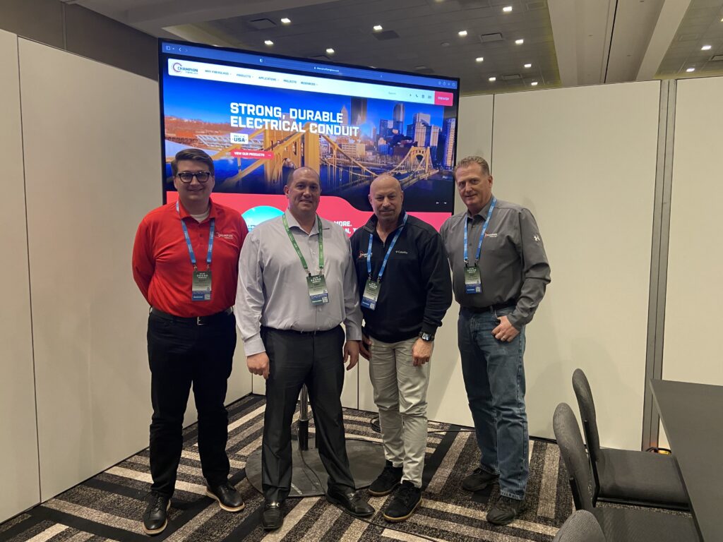 The Delta Electrical team accepts an award from Champion Fiberglass.