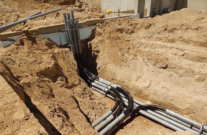 electrical conduit being buried underground